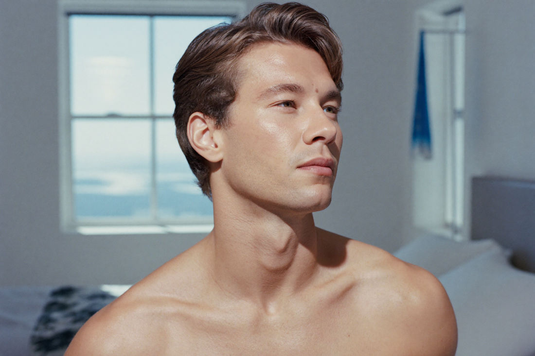 A man with clear, refreshed skin in bright morning light