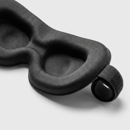 NOXFORM BLACKOUT sleep mask, close-up of contoured eye cups and adjustable strap